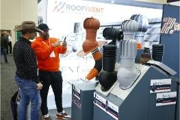 IRE attendees at an exhibitor's booth
