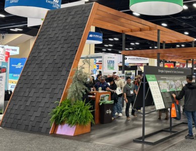 Attendees at a booth at IRE