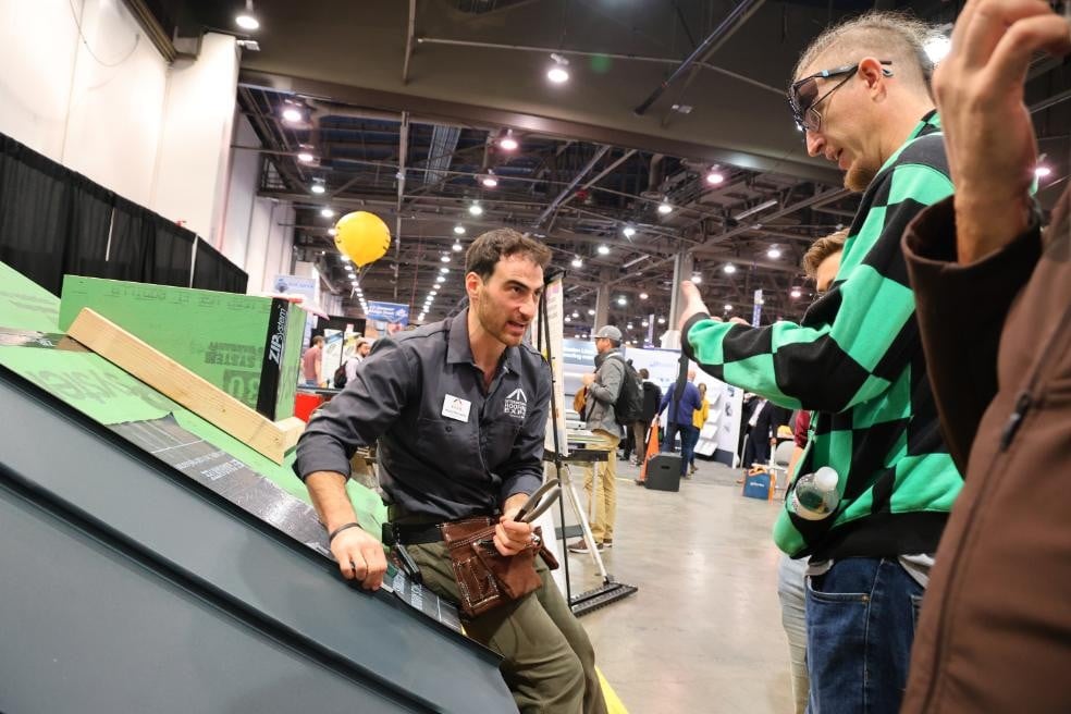A roofing expert demonstrating a product